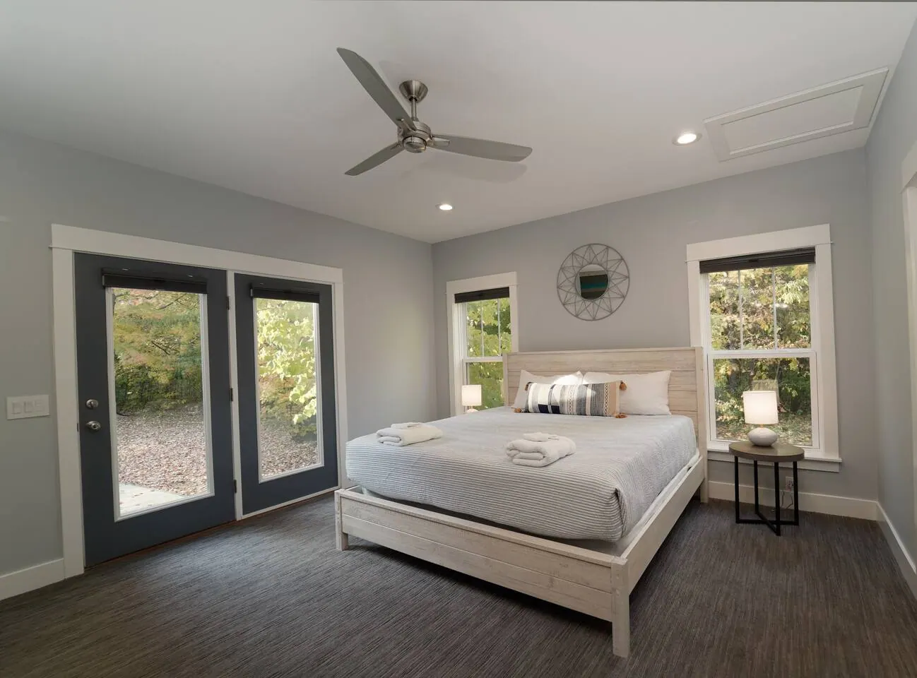 Primary bedroom with a king bed and glass doors to the outdoors